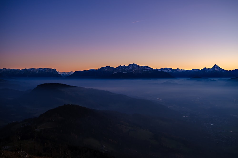 a view of a mountain range at sunset