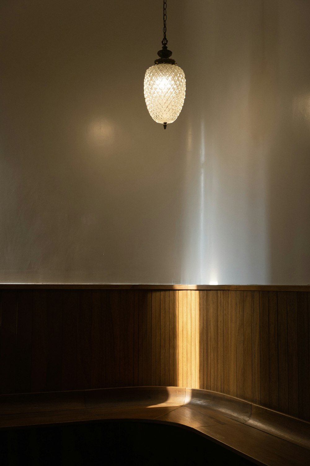 a light fixture hanging from a ceiling in a room