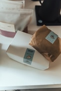 a brown paper bag sitting on top of a white counter