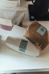 a brown paper bag sitting on top of a white counter