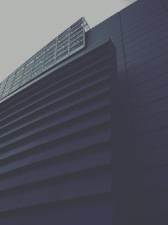 Sleek modular commercial container space with dark metallic finishes and minimalist design