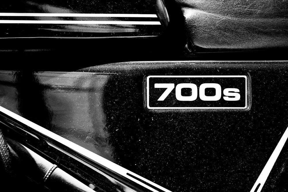 a black and white photo of the emblem on a vehicle