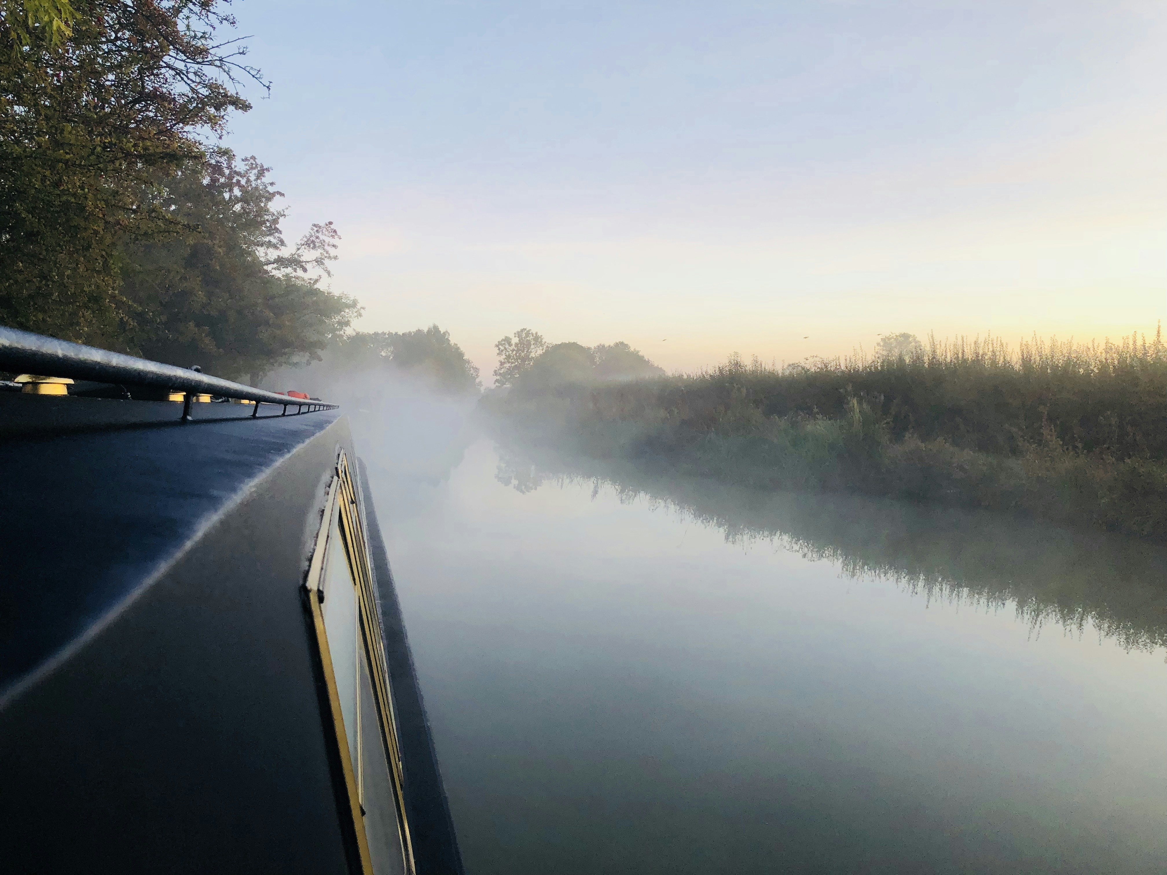 a train that is traveling down the river