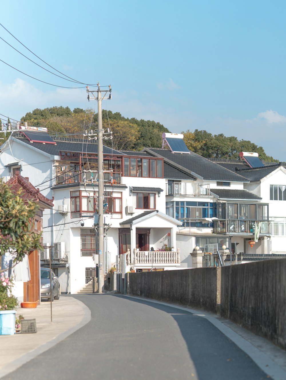 a street lined with houses and power lines