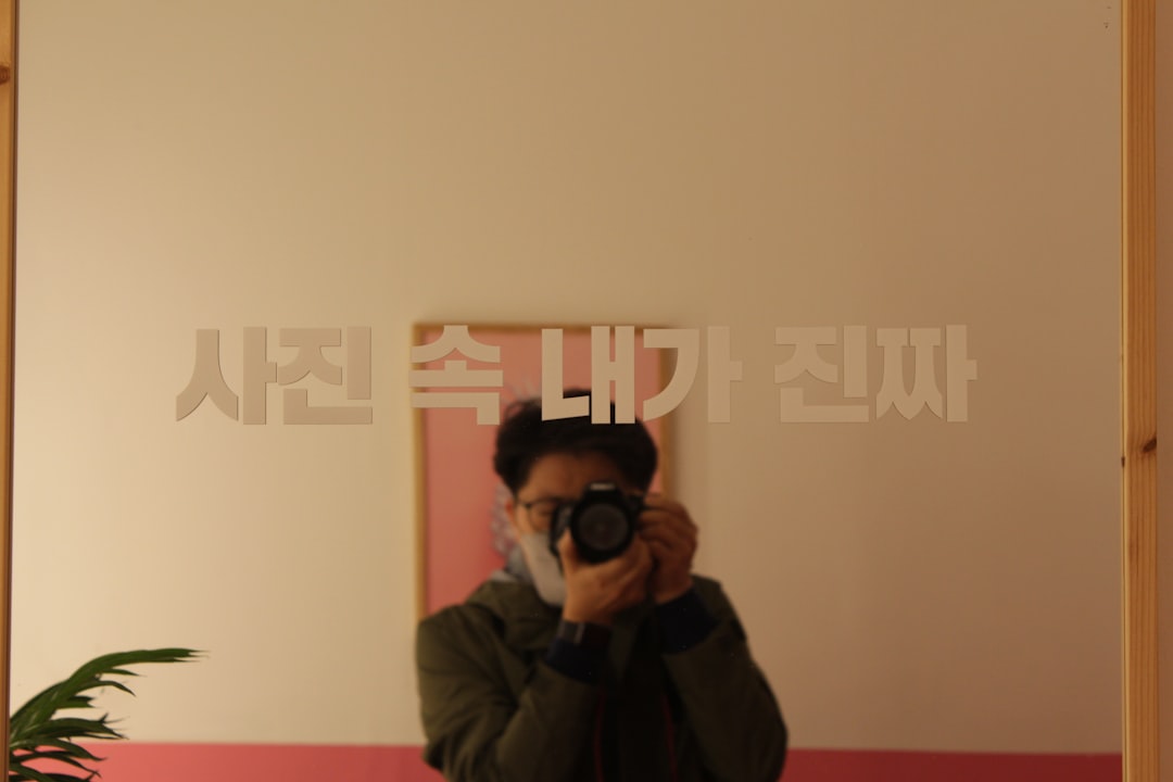 a person taking a picture of themselves in a mirror