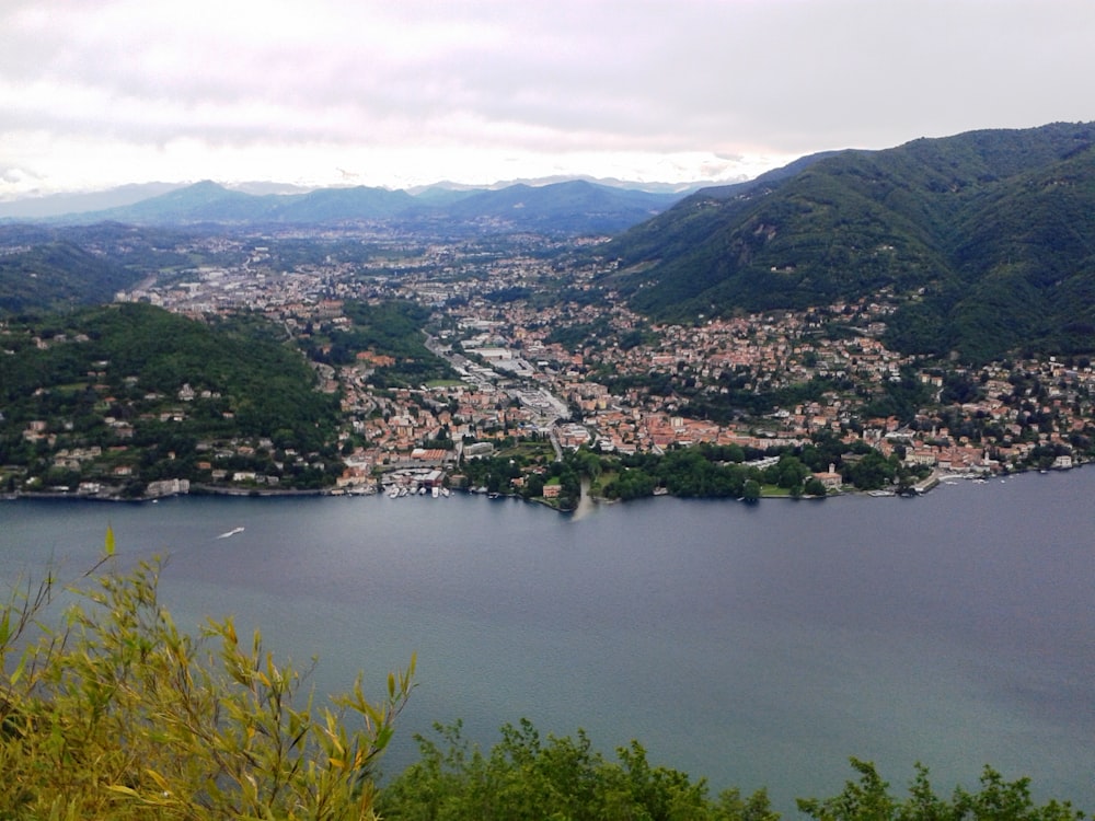 a scenic view of a city and a lake