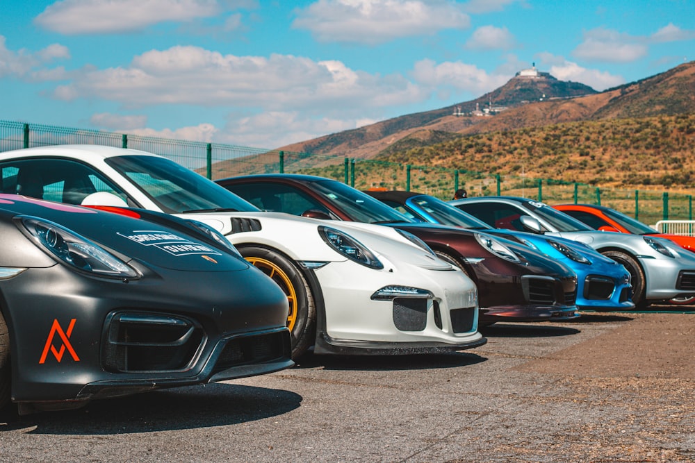 a row of cars parked in a parking lot