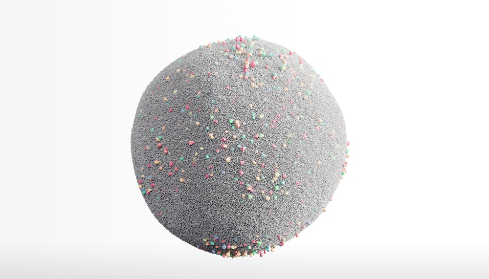 a large gray ball with sprinkles on it
