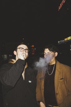 a couple of men standing next to each other