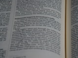 A close-up of a page from a book with text in two columns. The text includes a heading in bold, emphasizing the section titled 'Nehemiah inspects Jerusalem's walls'. The book appears to be a religious or historical text with a narrative style.