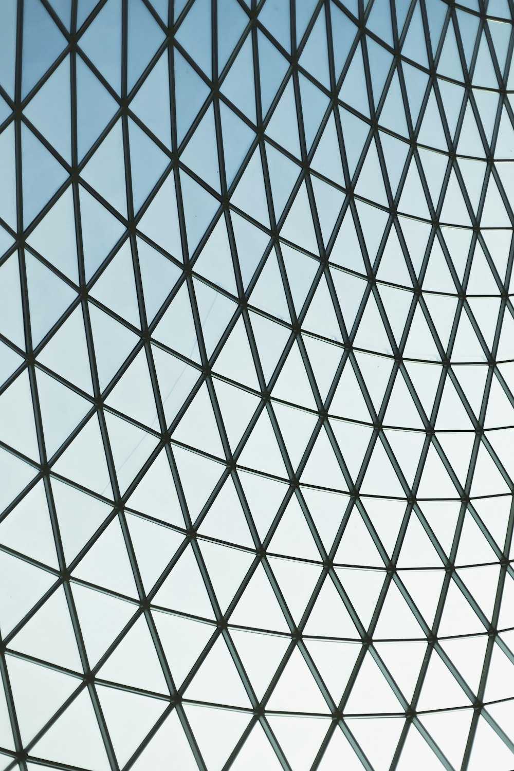 a close up of a metal structure with a sky background