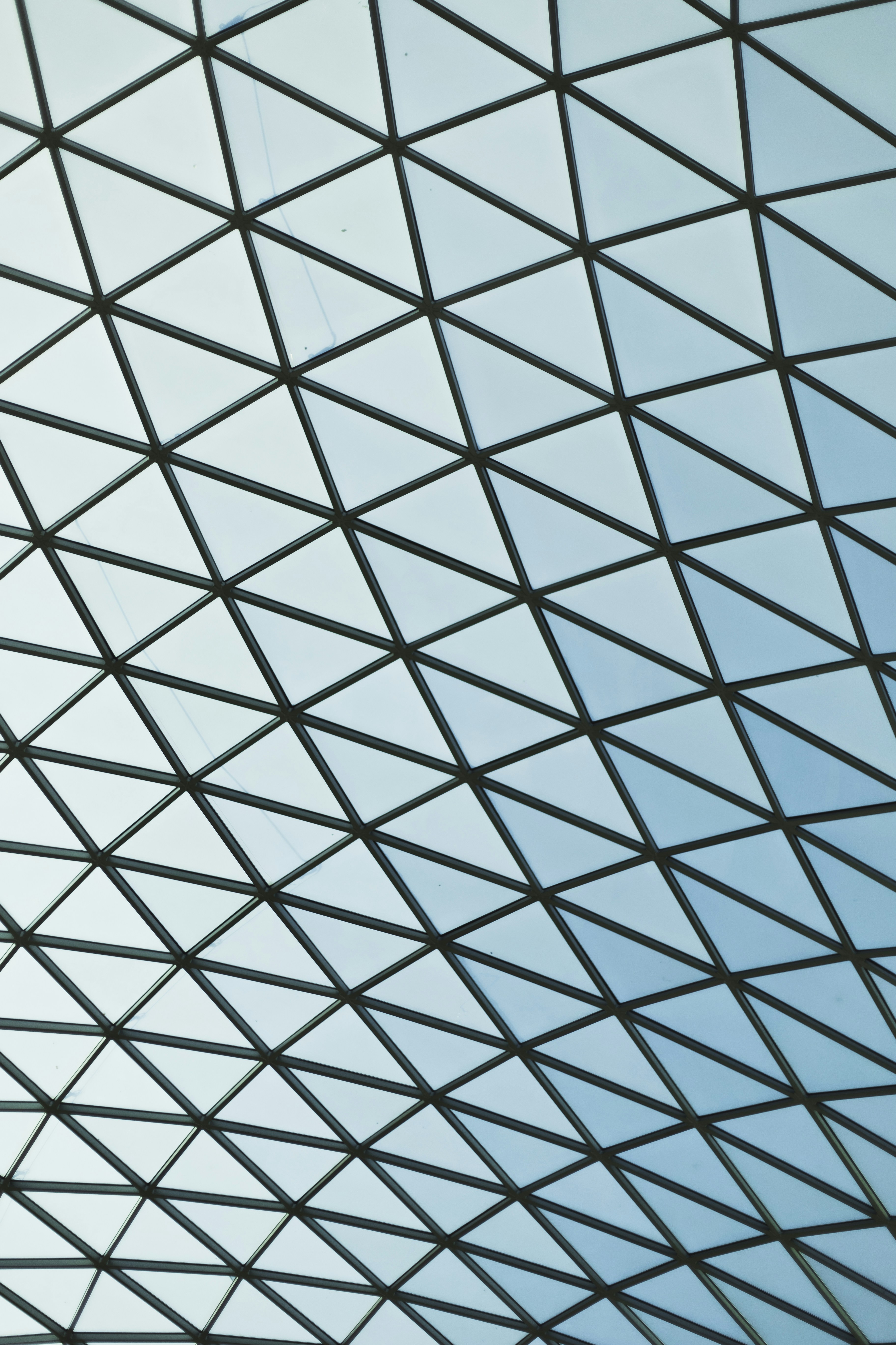 an airplane is flying in the blue sky