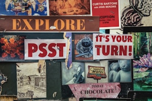 A collage of various signs and images with vintage and artistic styles. Includes text like 'EXPLORE', 'PSST', 'IT'S YOUR TURN!', and 'TODAY CHOCOLATE'. There are images of a coffee cup, a Caprice Motel sign, artistic drawings, and a photo with bears.