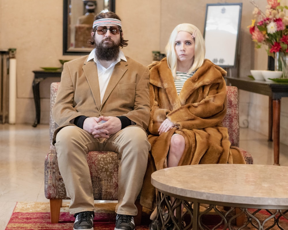 a man and a woman sitting on a chair