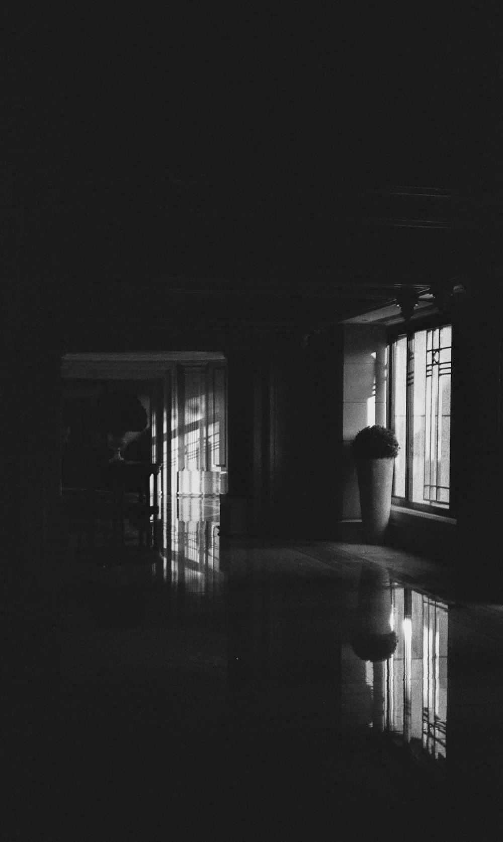 a black and white photo of a living room