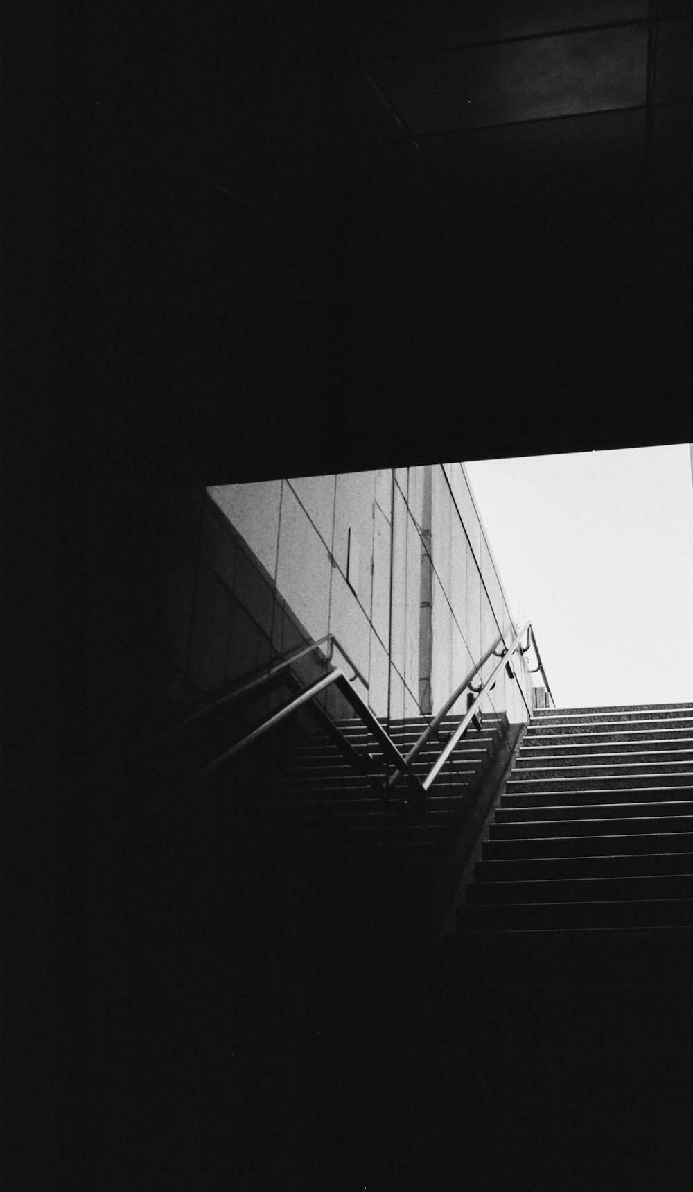 a black and white photo of a stair case