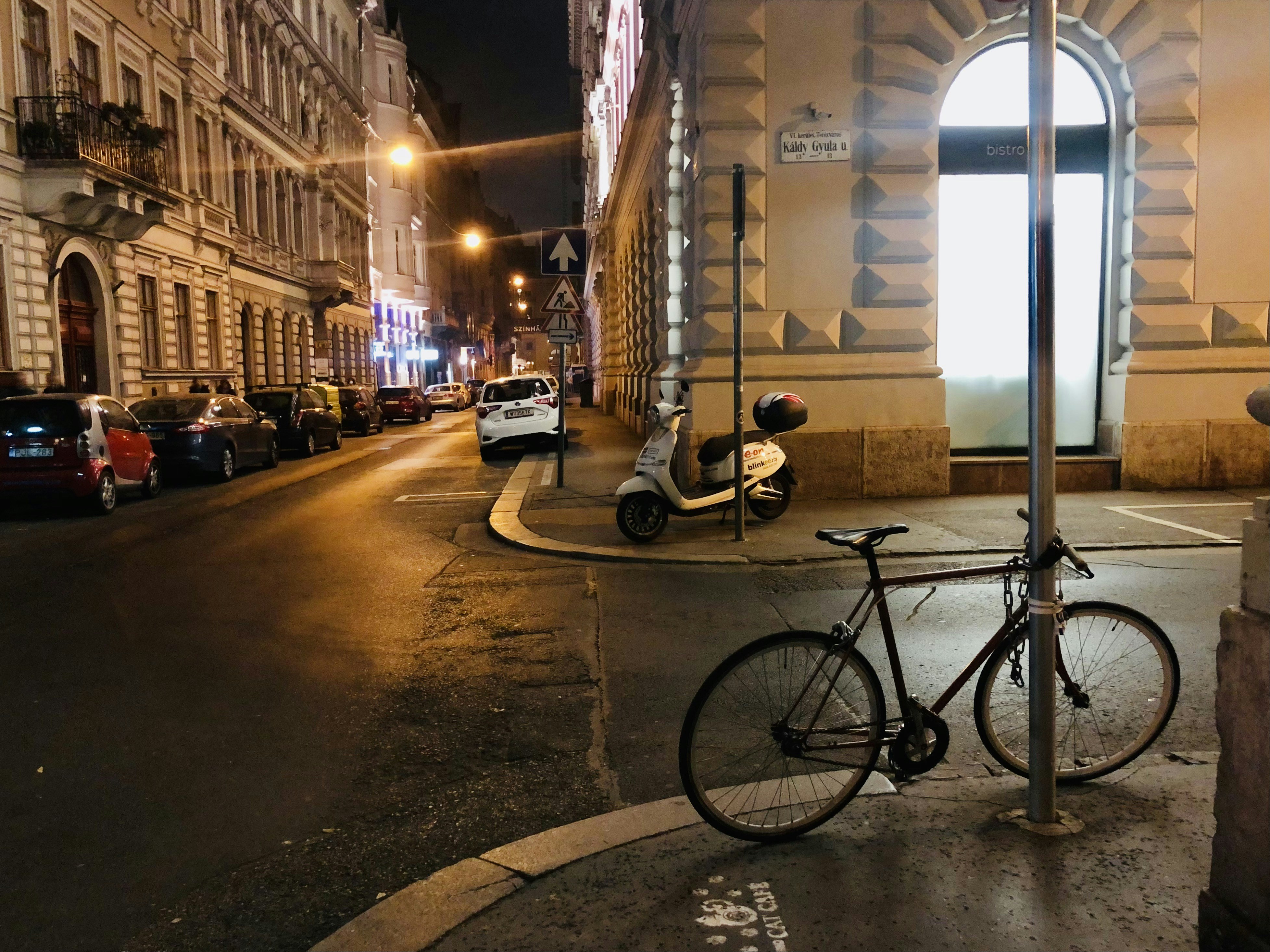 a bike parked on the side of a street