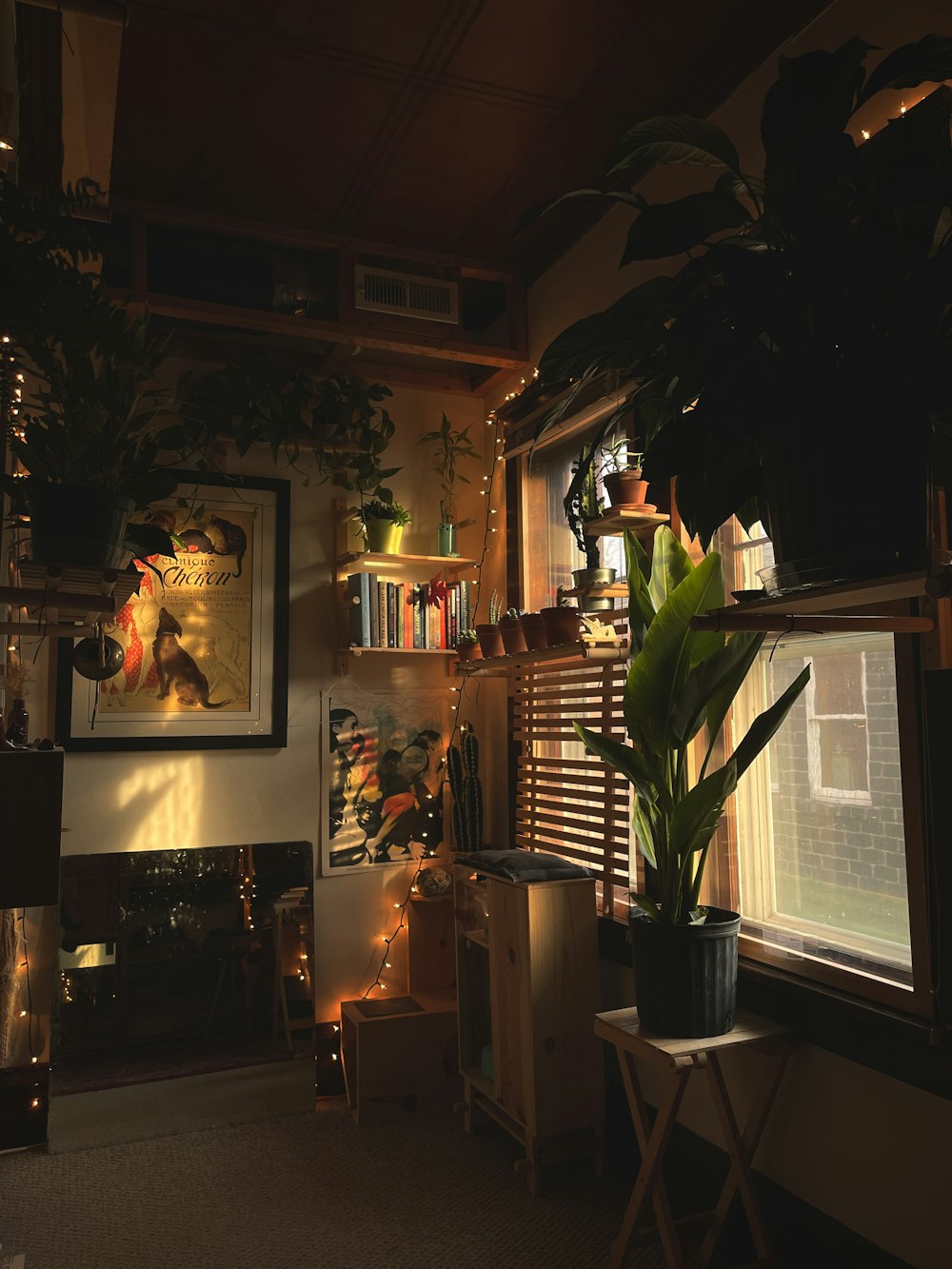 a room filled with furniture and vase of flowers on a table