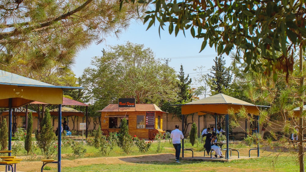 a group of people walking around a park