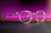 a pair of glasses sitting on top of a table