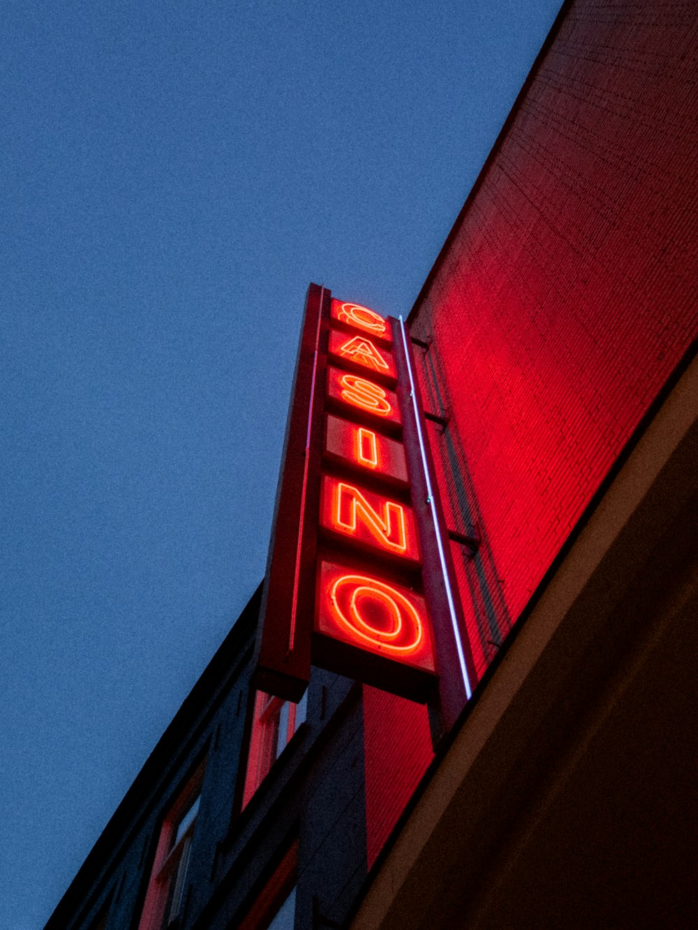 a neon sign on the side of a building