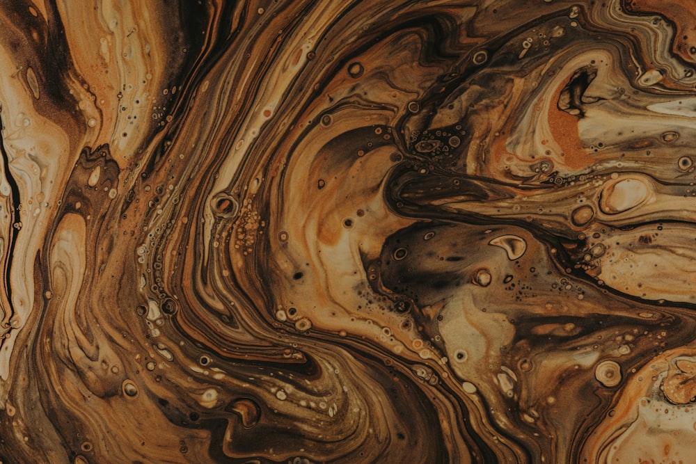 a close up of a brown and black marble