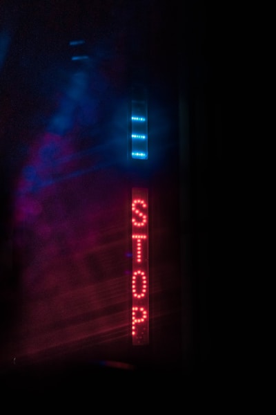 a sign that is lit up in the dark