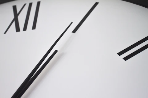 a close up of a clock showing the time