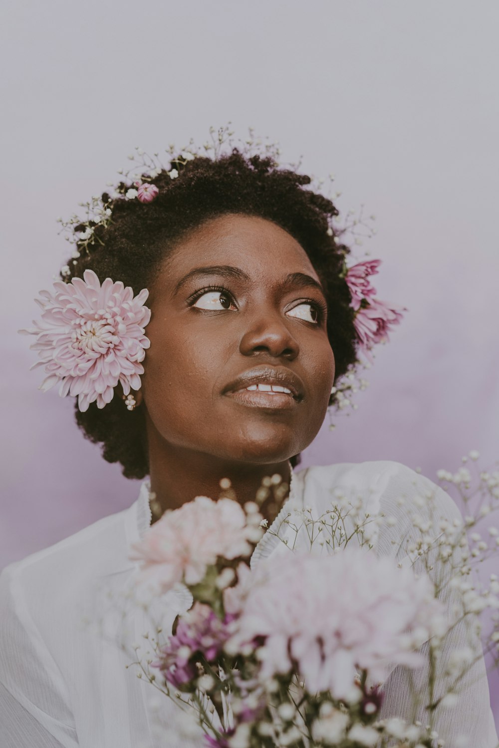 a woman with flowers in her hair