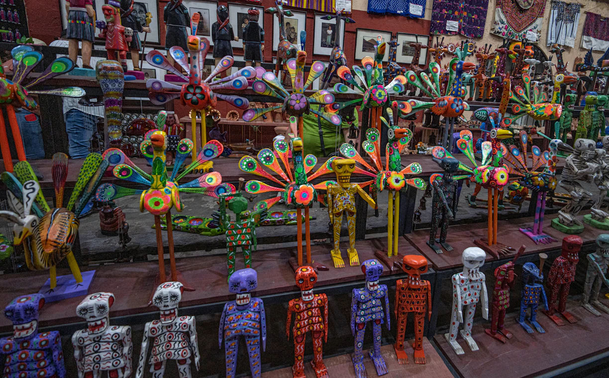 a display of colorfully painted skeletons in a store window
