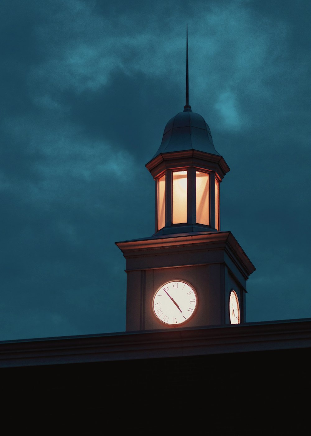 a clock tower with a sky in the background