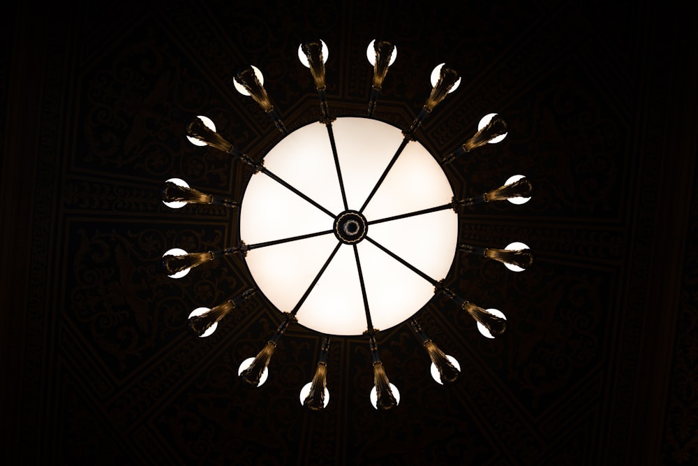 a circular light fixture in a dark room