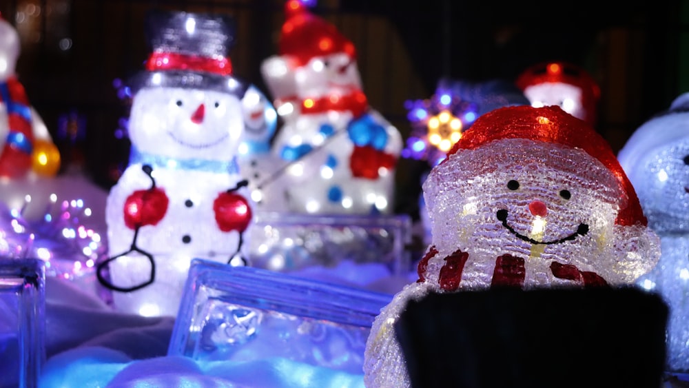 a group of snowmen that are standing in the snow