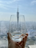 Close-up of clean glass reflecting the skyline.