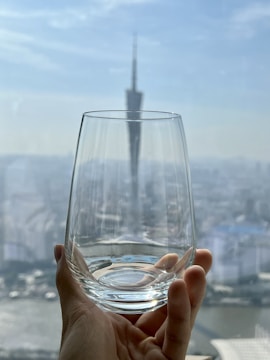 Close-up of clean glass reflecting the skyline.