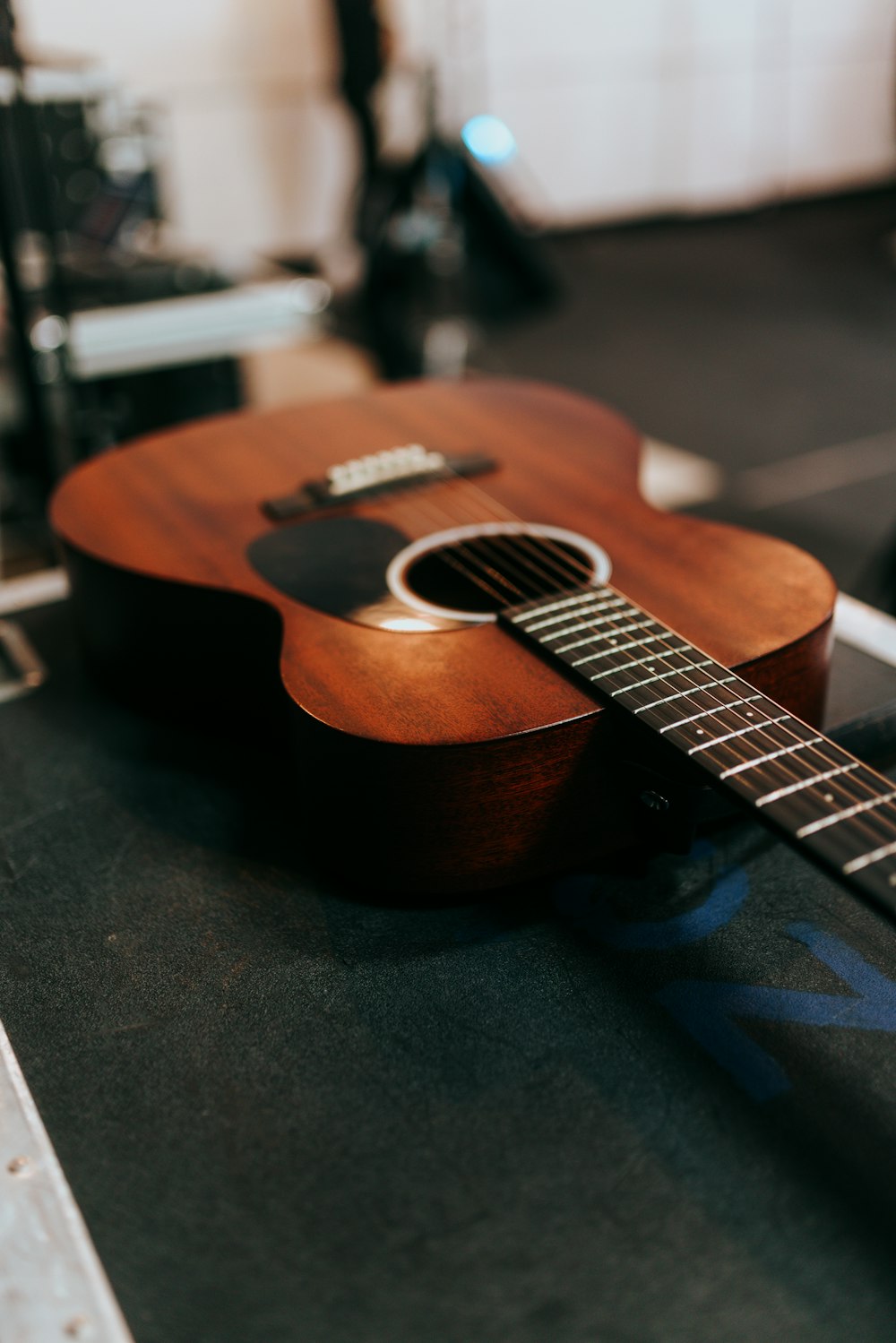 a guitar sitting on top of a table