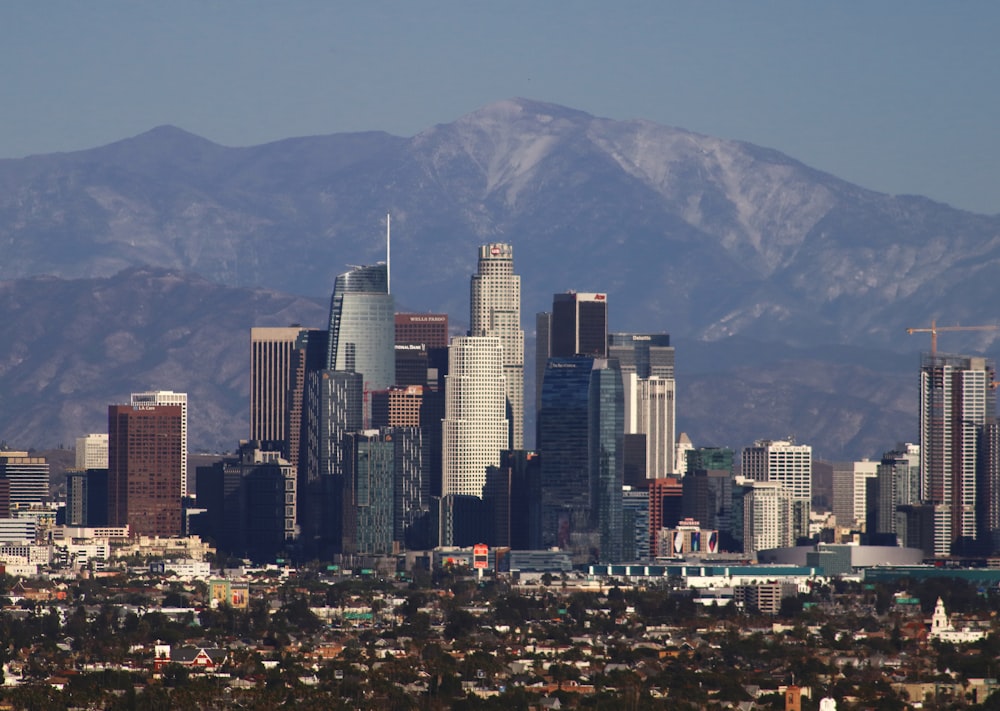 a view of a city with mountains in the background