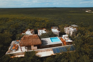 an aerial view of a house with a swimming pool