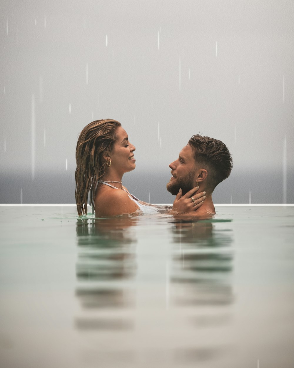 a man and a woman are in the water