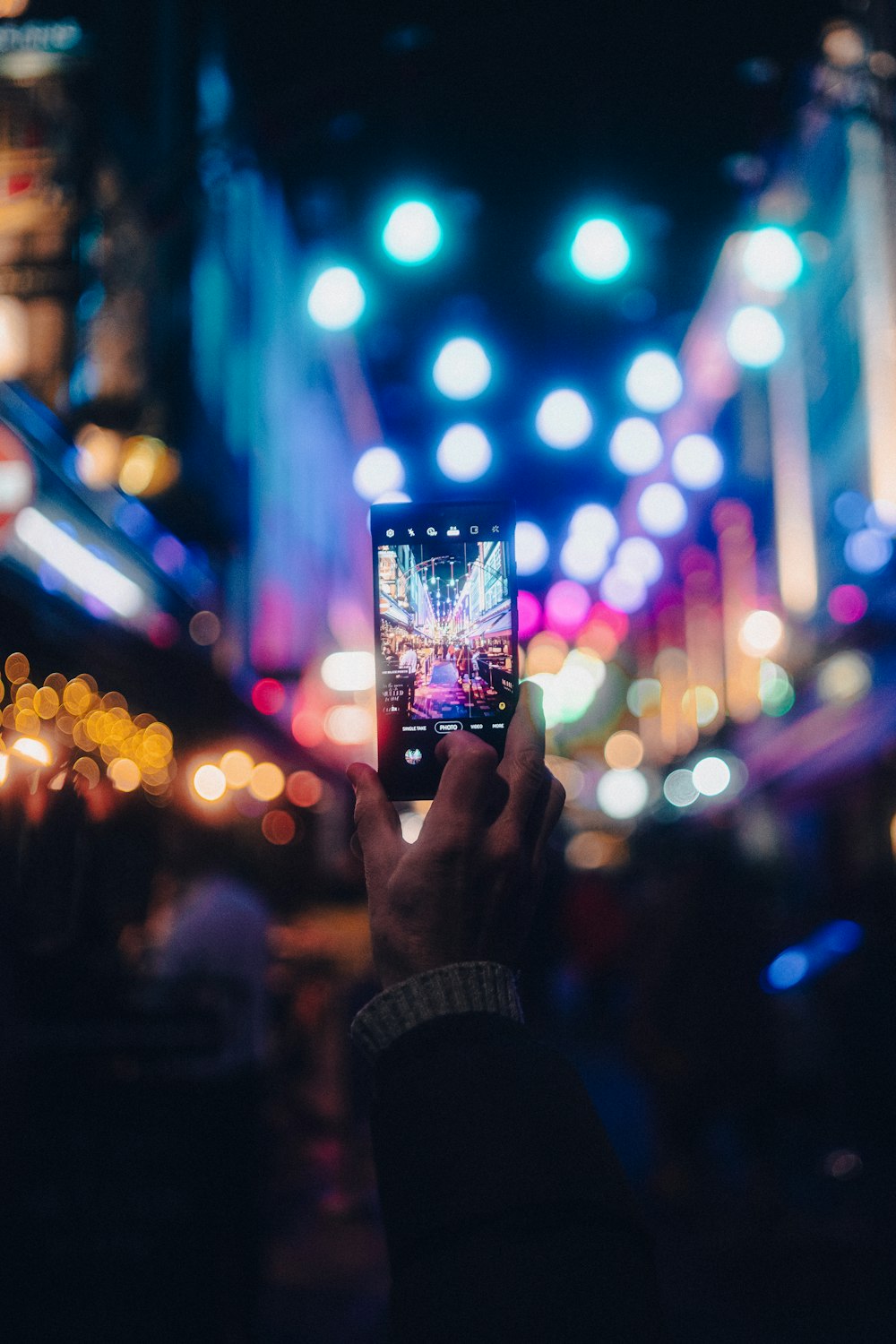 a person taking a picture with a cell phone