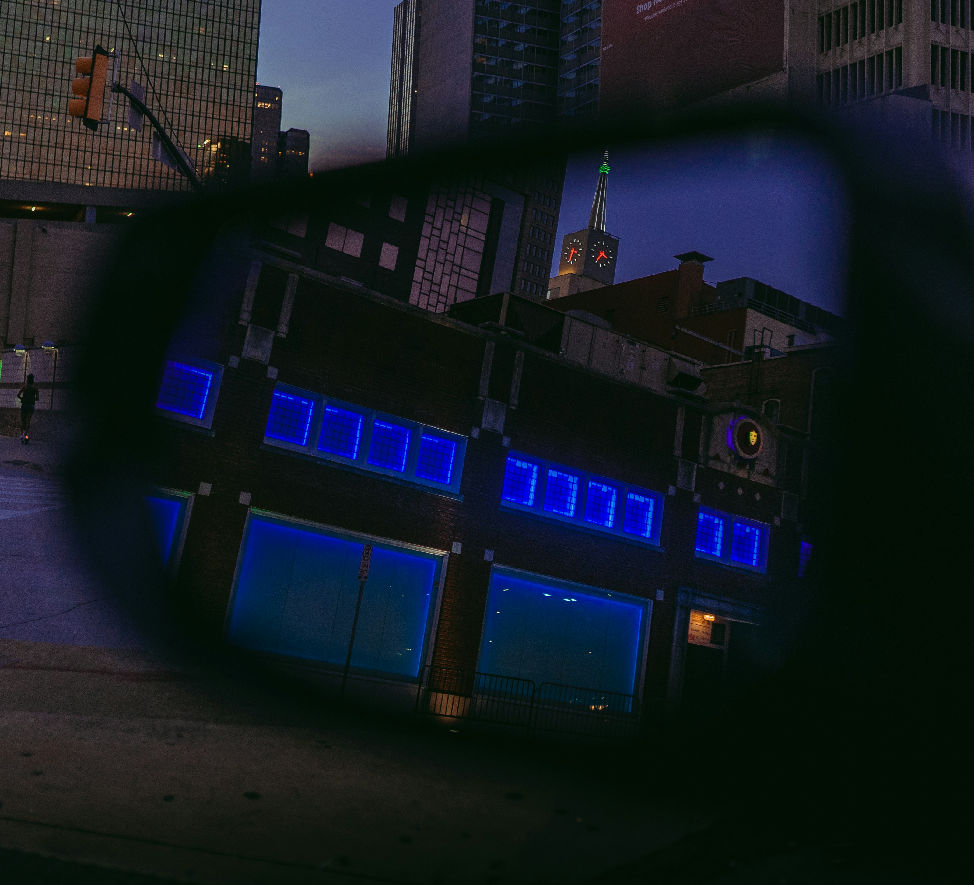 a view of a building through a rear view mirror