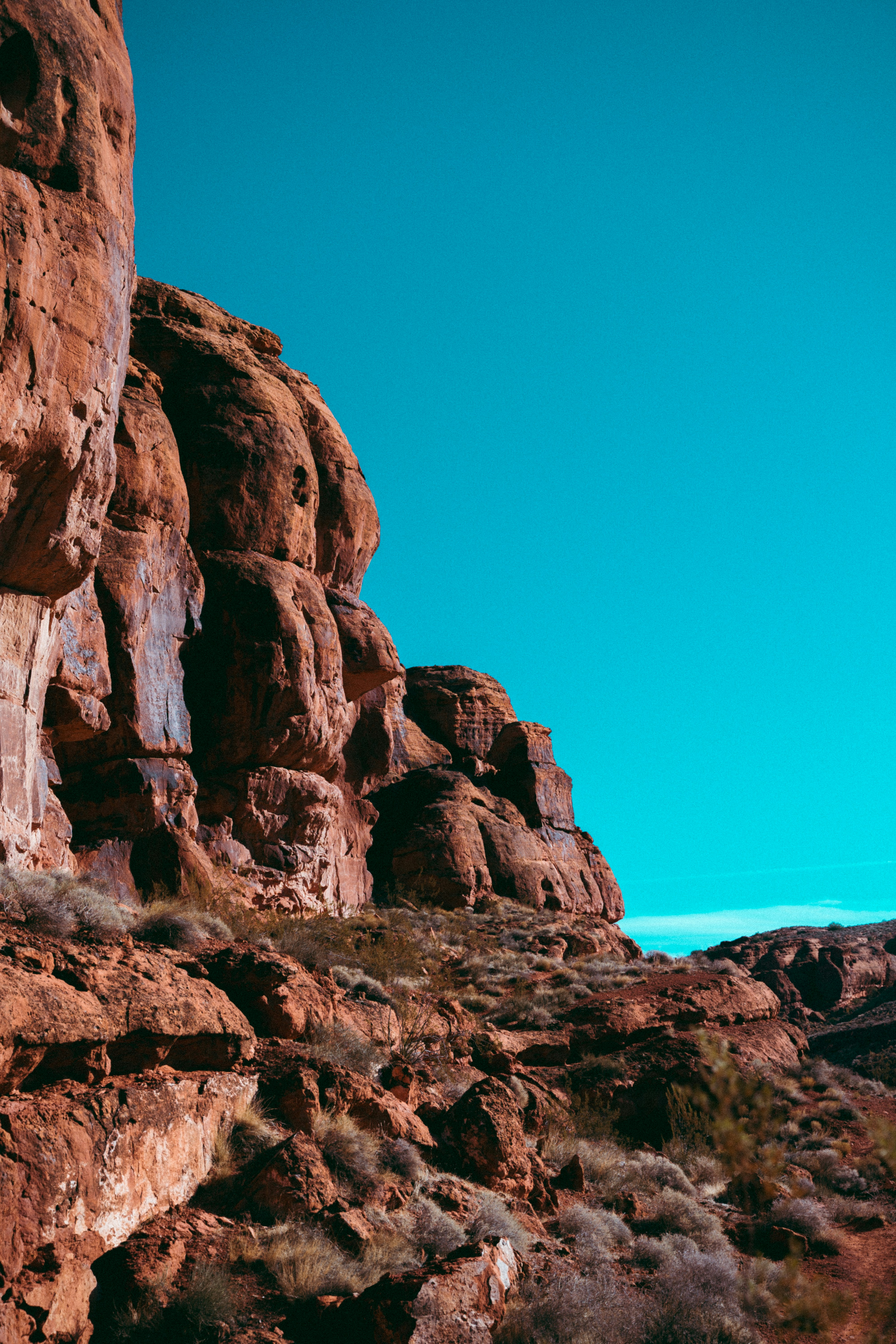 a person standing on top of a rocky hill
