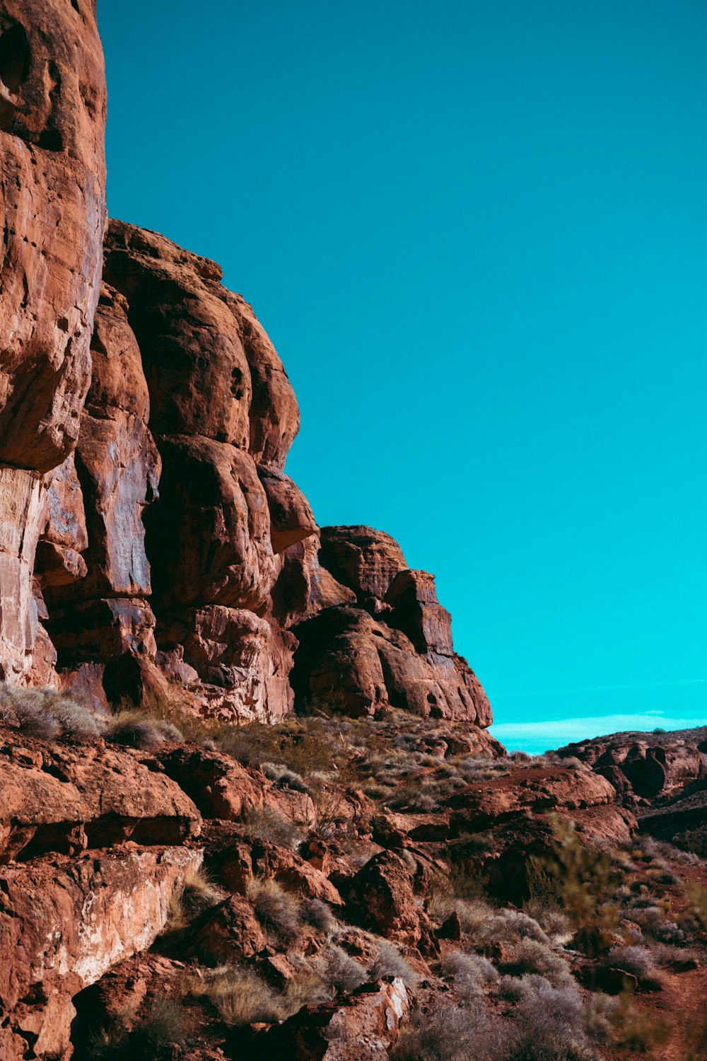 a person standing on top of a rocky hill