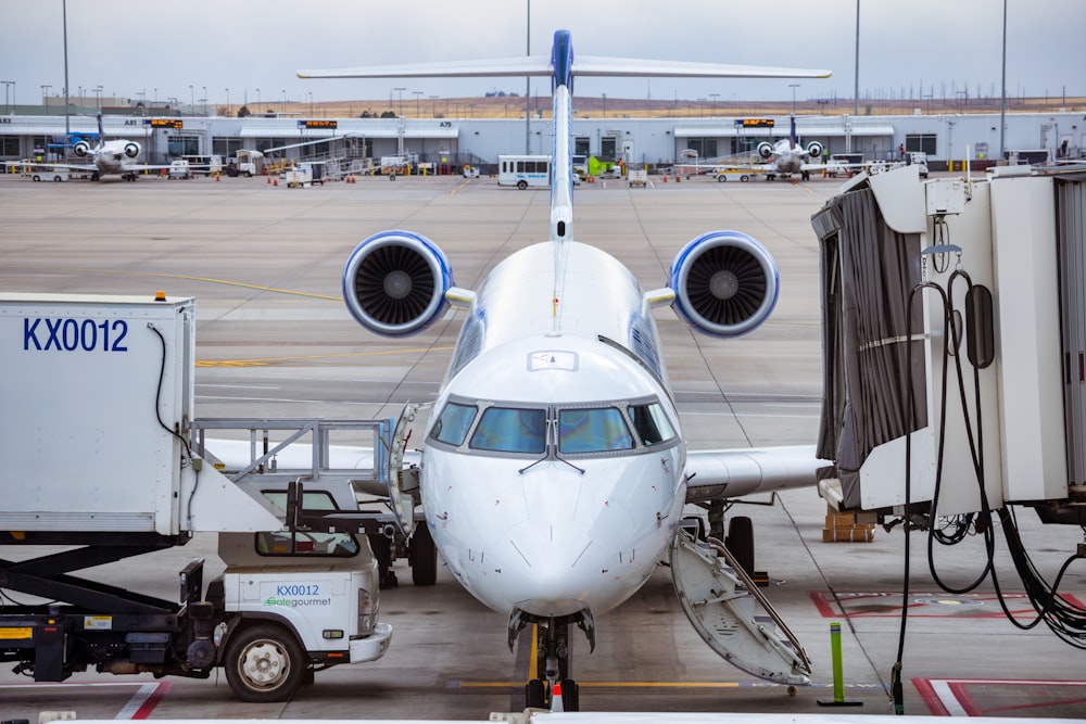 a large jetliner sitting on top of an airport tarmac