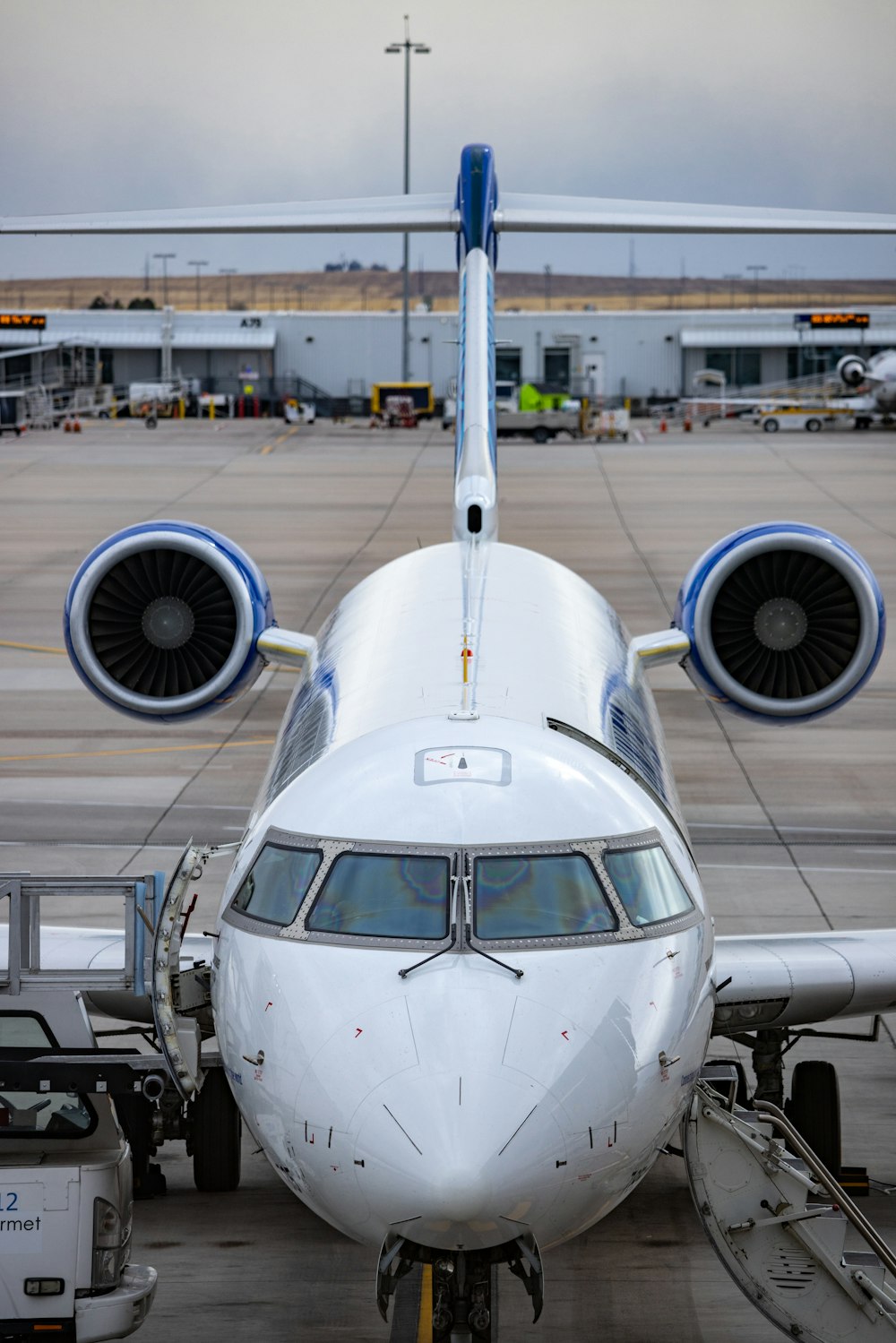 a large jetliner sitting on top of an airport tarmac