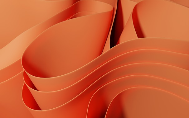 a close up of an orange background with wavy lines
