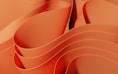a close up of an orange background with wavy lines