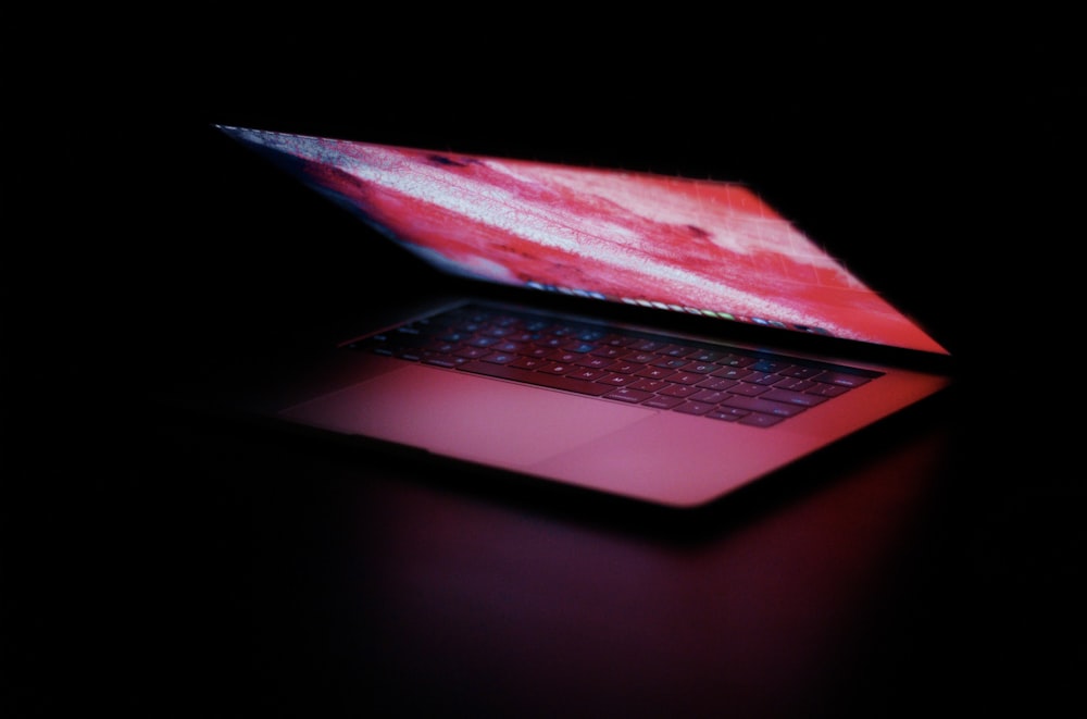 a laptop computer sitting on top of a table