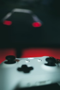 Close-up of a gamer’s hands on a controller, with Nairobi’s skyline blurred in the background.