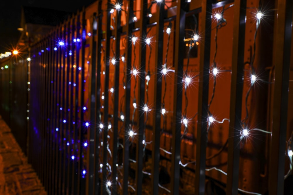 a fence with a bunch of lights on it